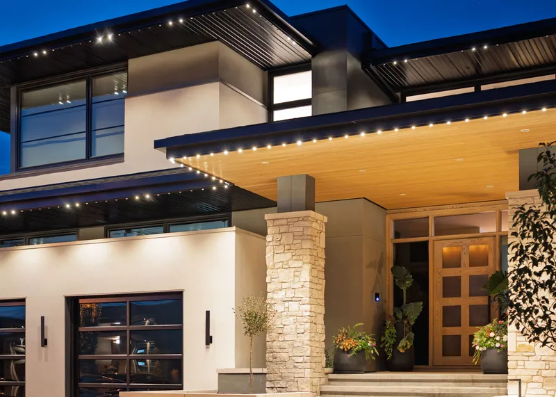 Warm white under the deep overhang of a modern home