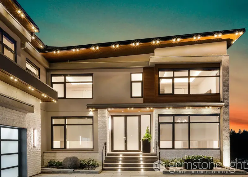 Warm white tracing a modern flat-roof home