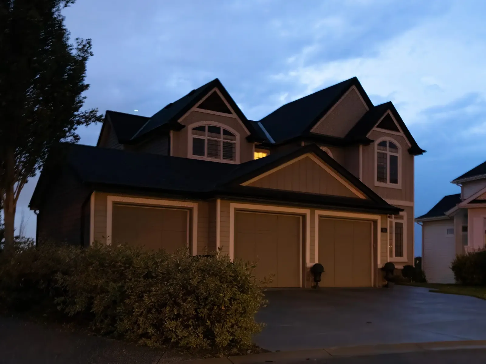 House at dusk with its roofline lights switched off
